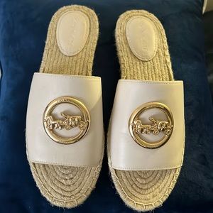 Slay this summer with a brand new pair of coach slip on sandals